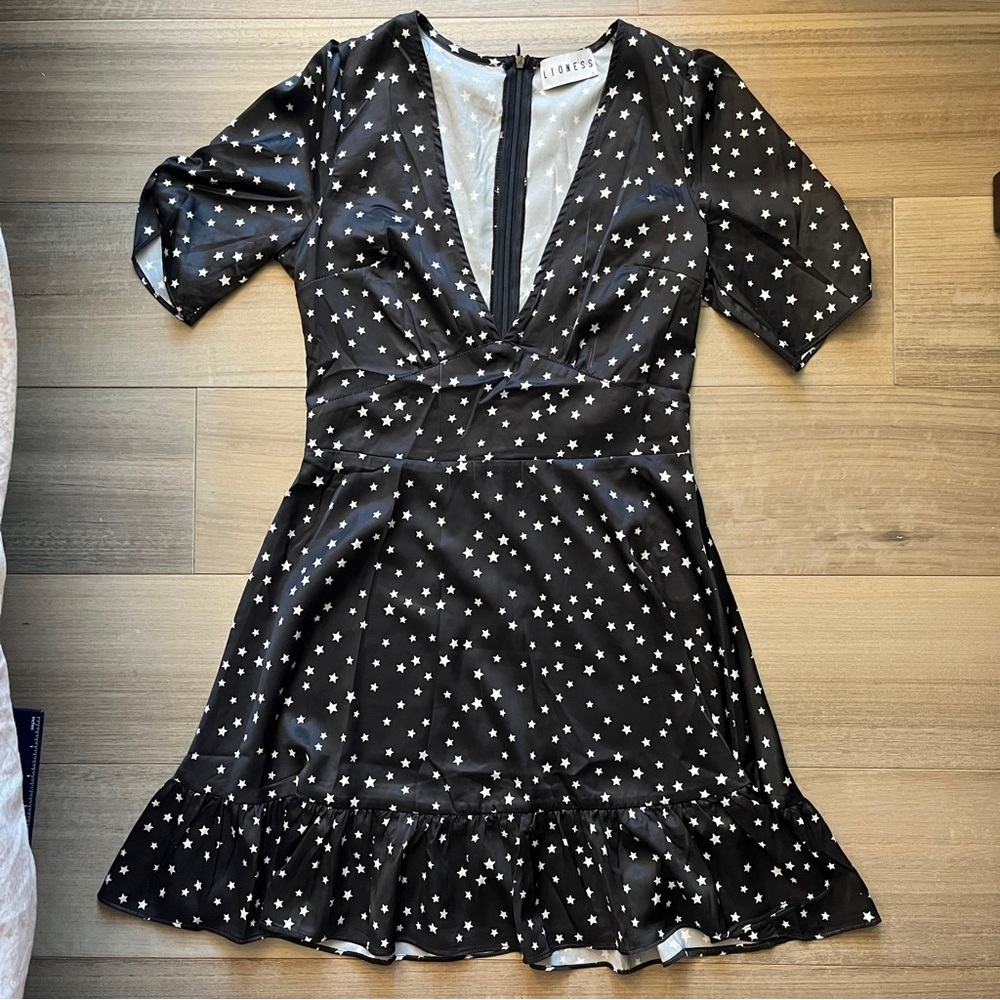Short black Lioness dress with white stars from Princess Polly.